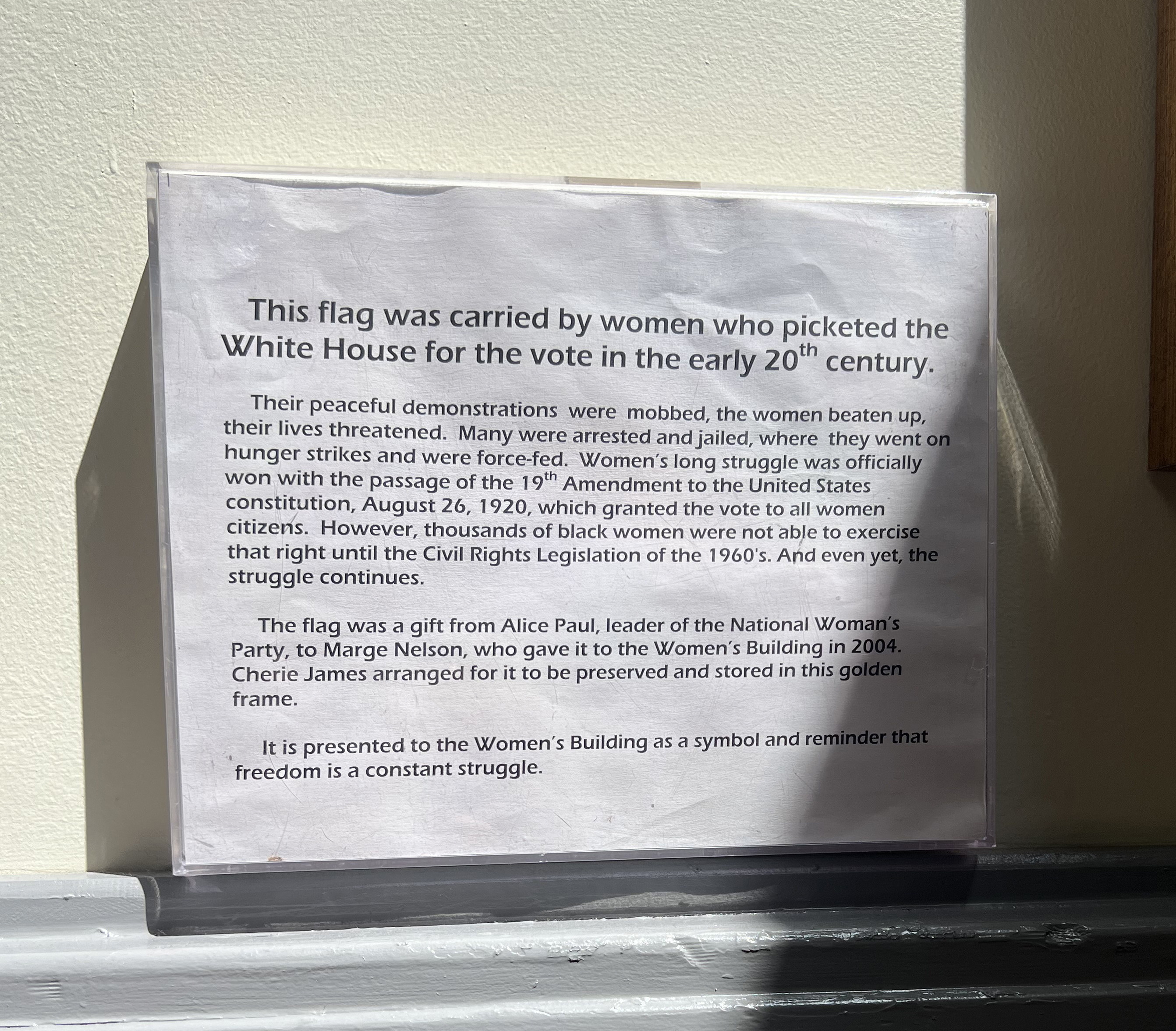 Flag and interpretive text at The Women's Building